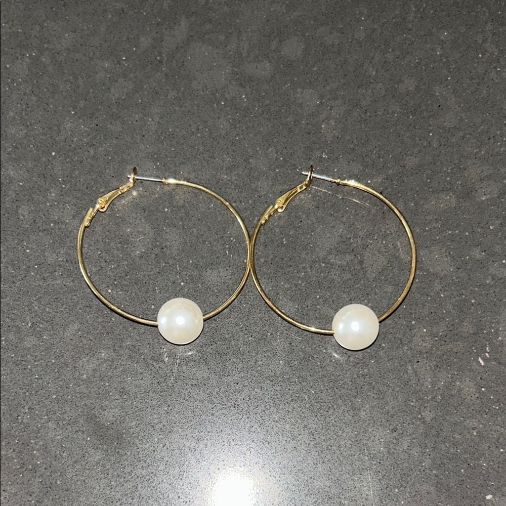 Gold tone pearl hoops